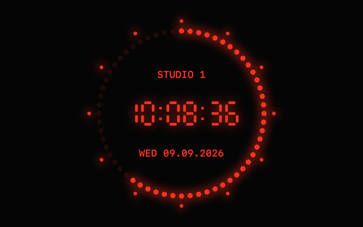 LED ring face: 60 red second dots, twelve markers, 10:08:36 in seven-segment digits, label STUDIO 1 and the date